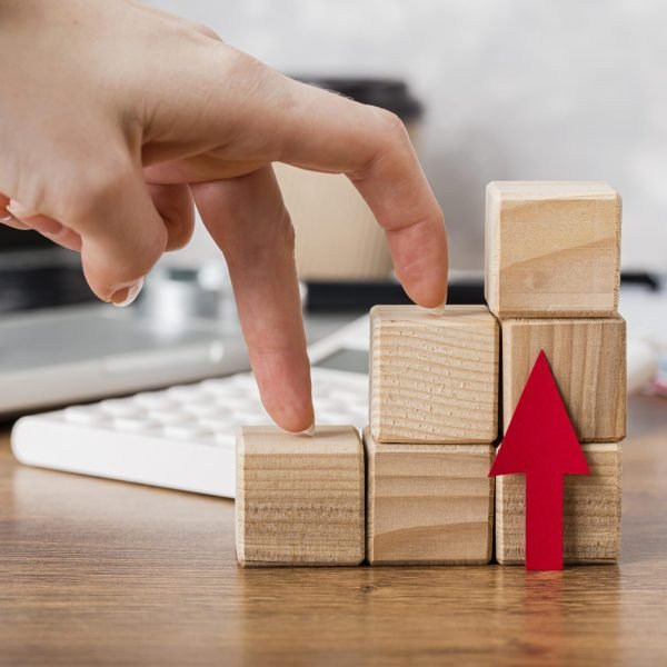 hand-climbing-wooden-blocks-represent-growth hand-climbing-wooden-blocks-represent-growth